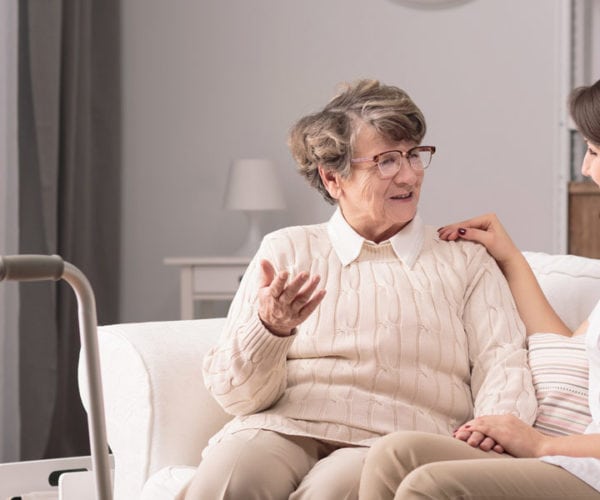resident talking with a caregiver